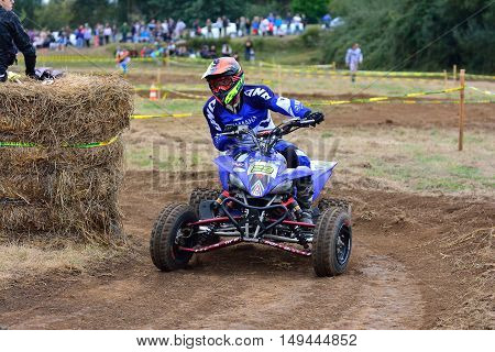 Unidentified Racer Rides A Quad Motorbike.