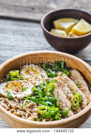 Bowl Of Chicken Ramen Soup On The Wooden Table