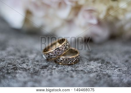wedding details of a ring white bouquet