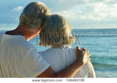 Happy elderly couple rest at tropical beac