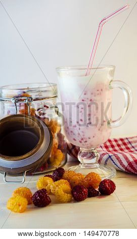 milkshake with berries fresh raspberries on a white background