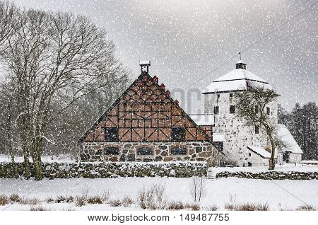 View of a snow covered Hovdala Castle in Hassleholm region. Hovdala Castle is a castle in Hassleholm Municipality Scania in southern Sweden.