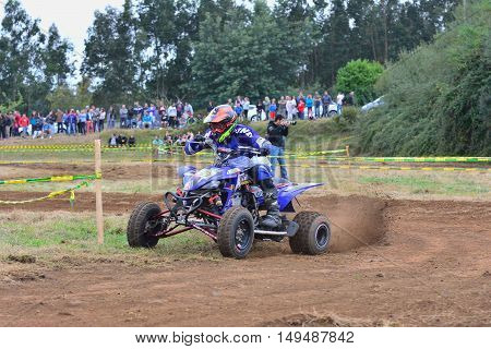 Unidentified Racer Rides A Quad Motorbike.