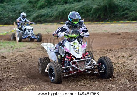 Unidentified Racer Rides A Quad Motorbike.