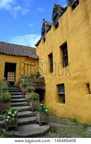 A set of stone steps leading to the entrance to the medieval palace in Culross