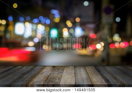 wooden terrace and City light with Bokeh night.Mock up for display or montage of productBusiness presentation