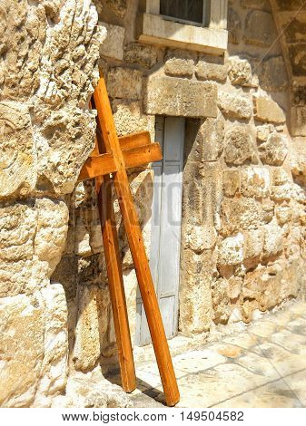Wooden cross and stone monastic cells on roof of Church of the Holy Sepulcher in Jerusalem israel.