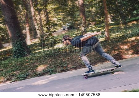 Longboard Skating - Skateboarder Ride A Longboard Through The Forest