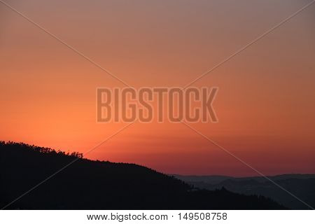Autumn red sunset over mountains Cinfaes Portugal