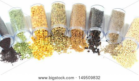Pulses and spices on a white background.