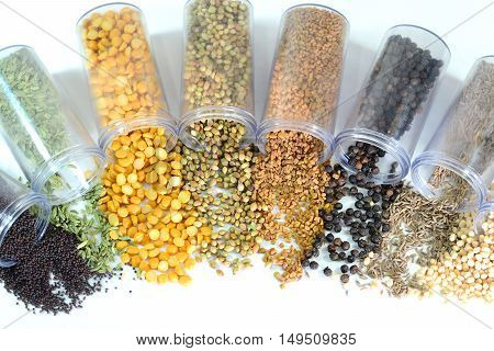 Pulses and spices on a white background.