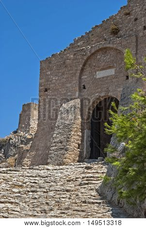 The walls and the main entrance to the old fortress of the ancient Acrocorinth. Peloponnese Greece.