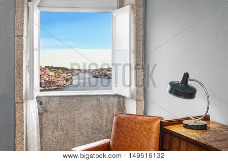 Interior retro stle setting by the window showing outside view of Porto