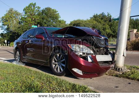 JACKSONVILLE, FLORIDA, USA - SEPTEMBER 23, 2016: A car crashes into a lightpole during the morning commute. In 2015, there were 374,445 reported car crashes in Florida.