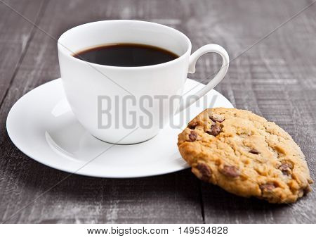 coffee cup with cookie for breakfast morning in cafe