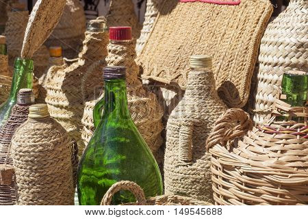 Some esparto handcrafts covering recycled glass bottles