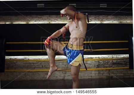 Man Fighter Muay Thai Stand in the ring