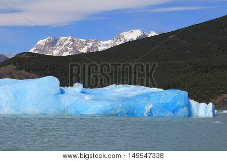 Snow capped mountain and blue iceberg in a lake. El Calafate Patagonia Argentina
