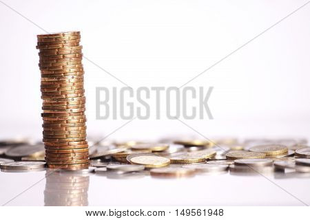 Gold coins stacked up isolated on white background