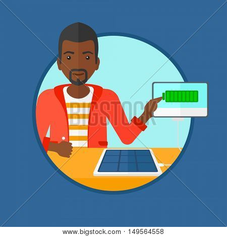 An african-american young smiling man charging tablet computer with solar panel. Charging tablet from portable solar panel. Vector flat design illustration in the circle isolated on background.