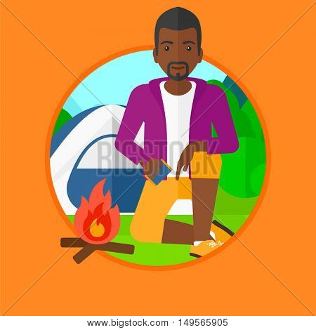 An african-american man kindling a campfire on the background of camping site with tent. Tourist relaxing near campfire. Vector flat design illustration in the circle isolated on background.