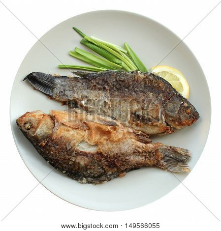 Roasted trout with shallot and lemon at the plate