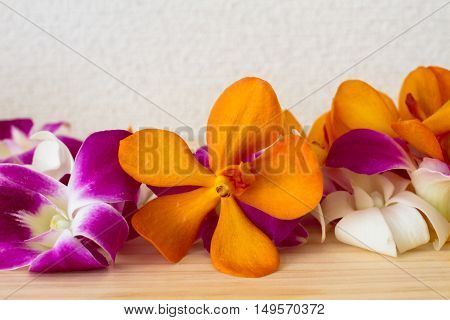 tropical flower on wood table . .