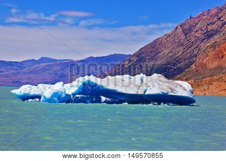 Excursion by boat to the huge white-blue glacier. Unique lake Viedma in Argentine Patagonia. The lake is surrounded by mountains