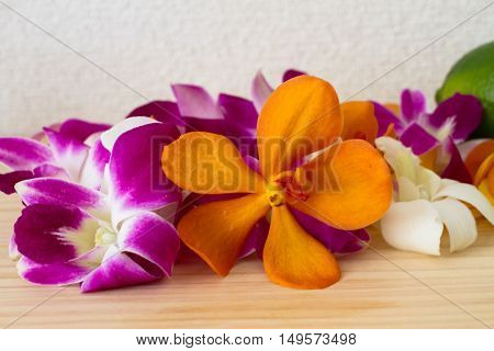 tropical flower on wood table . .