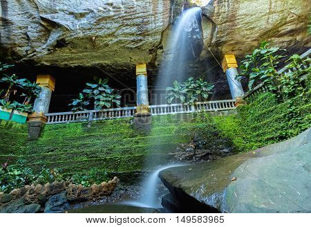 Amazing Thailand the temple under waterfall Wat Tham Heo Sin Chai waterfall. Kaeng Tana National Park Ubonratchathani Thailand