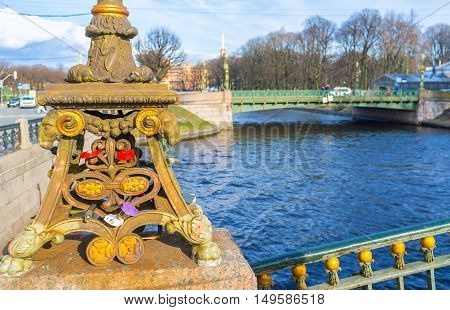The close-up of the decoration of Malokonushenny bridge with the view on the Second Sadovy bridge on the background St Petersburg Russia.