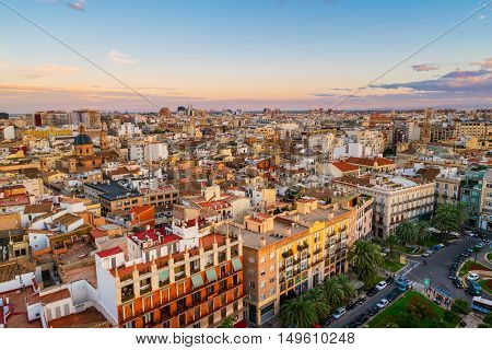 Aerial view of Valencia, Spain in the evening. Plaza de la Reina with many cafes and restaurants, very popular among tourists. Cloudy colorful sky