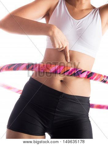 Woman working out with hoola hoop daily excercise at home