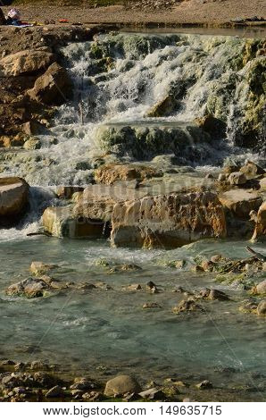 Sediment and waterfalls at the Saturnia thermal bath.