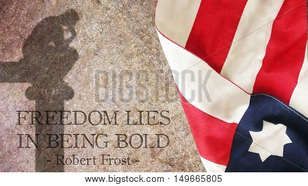 Freedom lies in being bold. Stars and Stripes on Stone. A phrase about liberty by Robert Frost.