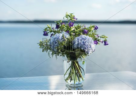 wedding decor on tables flowers blue and violet