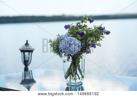 wedding decor on tables flowers blue and violet