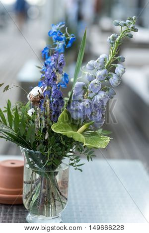 wedding decor on tables flowers blue and violet