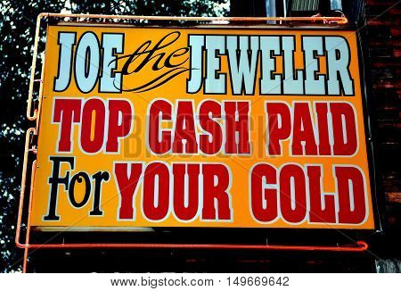Philadephia Pennsylvania - June 26 2013: Joe the Jeweler's shop sign offering top casg for gold on South 8th Street in the jewelry district