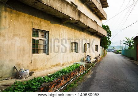 Outside wall of an old house in a street in rural Taiwan