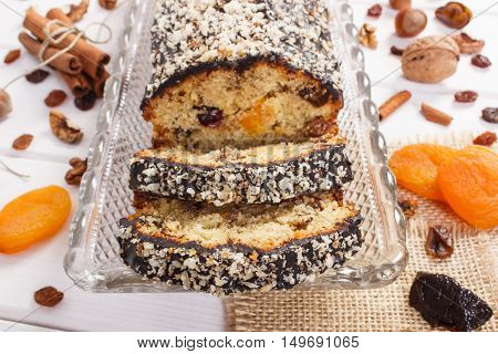 Fresh Baked Fruitcake With Ingredients On Boards