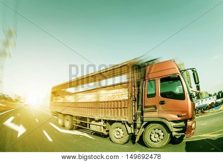 Busy construction site a large truck speed by.