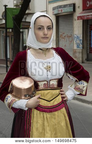 QUARTU S.E., ITALY - September 15, 2013: Wine Festival in honor of the celebration of St. Helena - Sardinia - portrait of a beautiful girl in the folk group of Isili