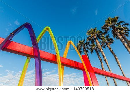 IMPERIAL BEACH, CALIFORNIA - OCTOBER 2, 2016:  Colorful entrance to the Pier Plaza with Surfhenge artwork by artist Malcolm Jones.