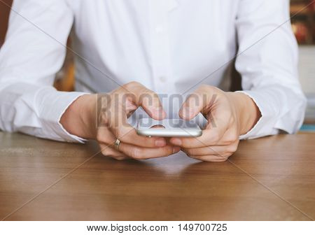 Close up of hands using smartphone business and social media concept