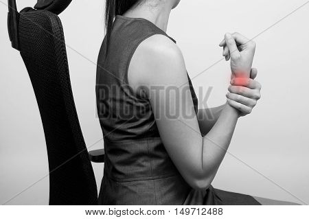a business woman with a wrist pain