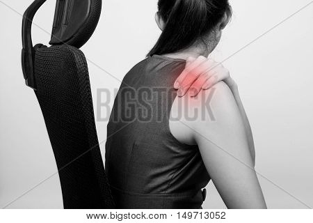 A woman with shoulder pain or stiffness