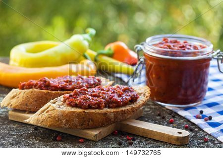 Traditional Macedonian and Serbian food. Homemade ajvar in jar.