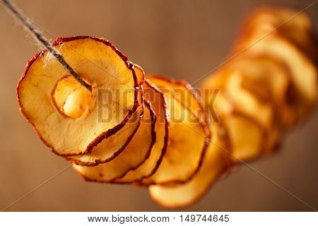 Dried apple slices and wooden backdrop