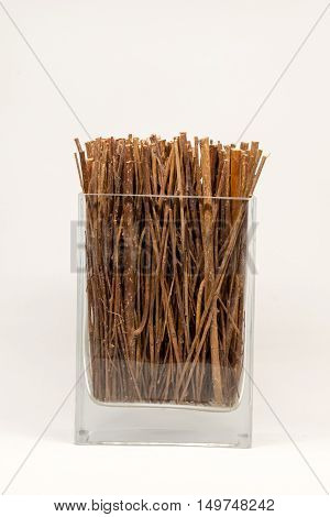 Dried twigs fre decoration in the glass bottle.